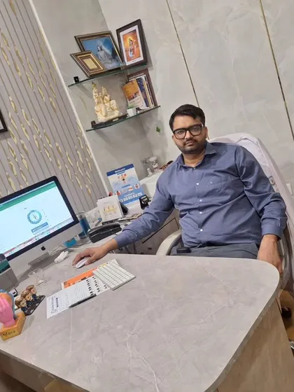 A photo of my colleague, Dr. Manish Jangra, in his office. We are ready to help you on your journey to renewed confidence.
