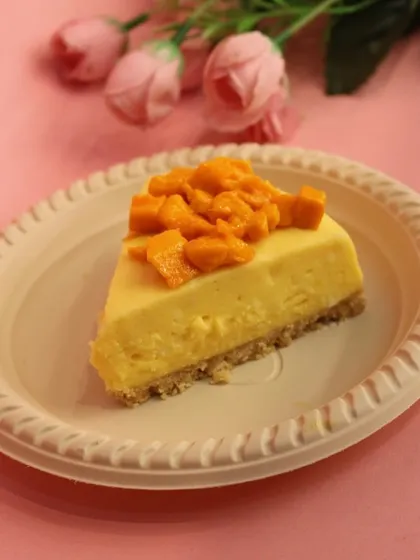 A slice of our popular Mango Cheesecake, a seasonal favorite that captures the taste of summer.