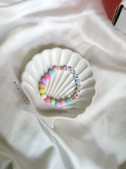 A single pastel beaded name bracelet for Samyukta. This simple and sweet design is one of our most requested styles.