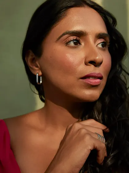 Here, we played with light and shadow to create a more contemplative mood. The way the light catches her face adds depth and dimension, perfect for a cinematic headshot.