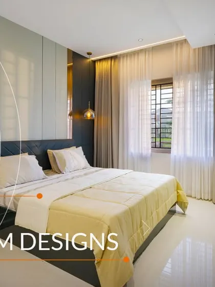 A sleek bedroom design with dark wardrobes, a light-colored accent wall, and large windows that let in plenty of natural light.