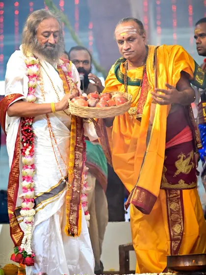I am making an offering of fruits during the Shat Chandi Homa. This act symbolizes offering the fruits of our actions and our lives to the divine will.