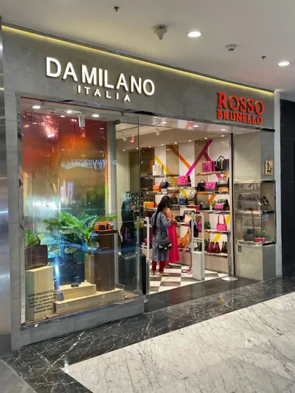 A similar view of the combined store in Chandigarh, showing the vibrant interior of the Rosso Brunello side.