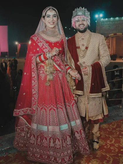A happy portrait of the bride and groom after their wedding ceremony. Their bright smiles show their relief and joy as they begin their new journey together.