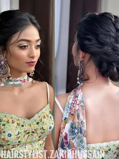 A full look featuring the braided updo, showing how it complements a modern lehenga for a chic party look.