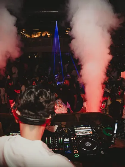 A fisheye lens captures the immersive club environment I create, with me at the center of the music, lights, and smoke.