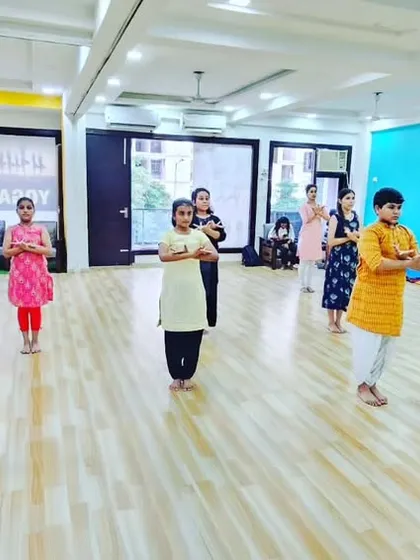 The class begins or ends with a traditional namaskaram, a gesture of respect to the guru, the earth, and the art form.