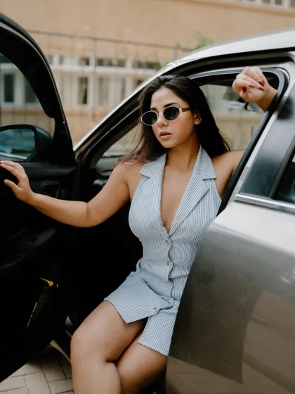 A duplicate of image 475, this creative portrait shot through a car window has an artistic and moody fashion feel.