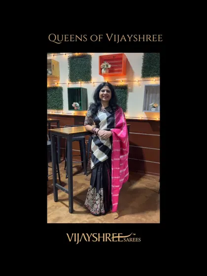 Our client Sumana looking chic and modern in a black and white Kanjivaram with a contrasting pink pallu.