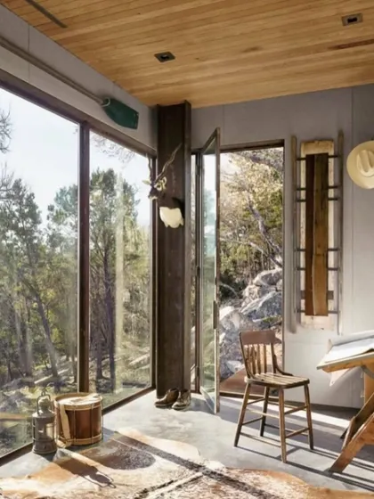 This rustic-modern interior shows how I can blend different styles. The large windows connect the indoor space with the natural landscape, creating a peaceful retreat.