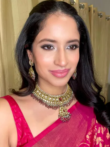 A soft smokey eye and pink lip for a wedding guest. This look is versatile and perfect for any party or special occasion.
