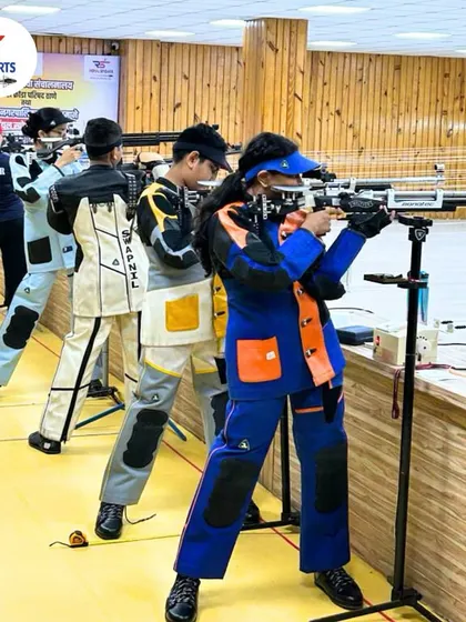 A full line of our competitive youth team, dressed in their shooting jackets, practicing their standing rifle positions. This showcases the dedication of our aspiring champions.