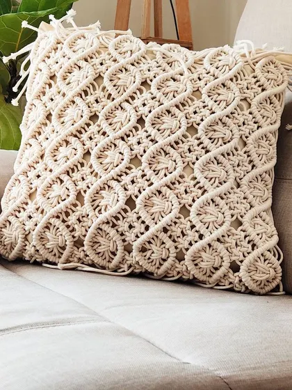The intricate wave-like pattern on this macrame cushion cover is one of my favorites.