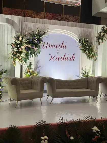 A duplicate image of the elegant engagement stage, providing another clear view of the backdrop and floral design.