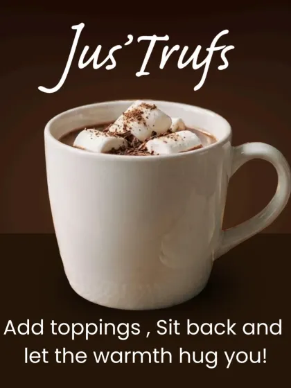 Our home serving guide finishes the hot chocolate with toppings, shown here with marshmallows and a dusting of chocolate.