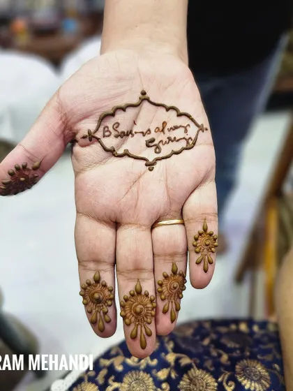 A minimalist design with a spiritual touch, featuring the phrase "Guru ji always bless". The fingertips are decorated with small, mandala-like patterns.