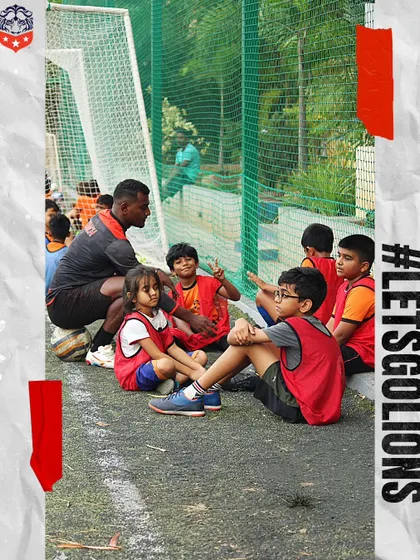 Mentorship is at the heart of our coaching philosophy. A coach takes a moment to speak with our youngest players, teaching them valuable lessons about the game and teamwork.