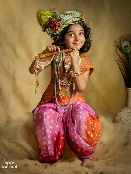 A duplicate of image 205, a beautiful and classic portrait of a child dressed as Krishna, holding his flute.