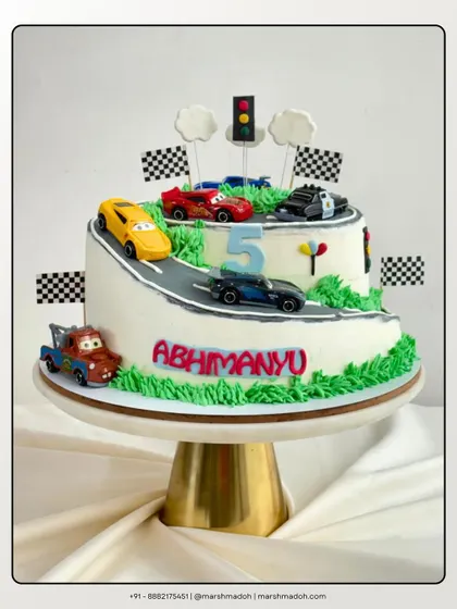 Who says you need fondant for a fun theme? This 3kg car-themed cake is covered in my signature, silky buttercream. Inside, it's packed with rich chocolate layers and my special in-house orange marmalade.