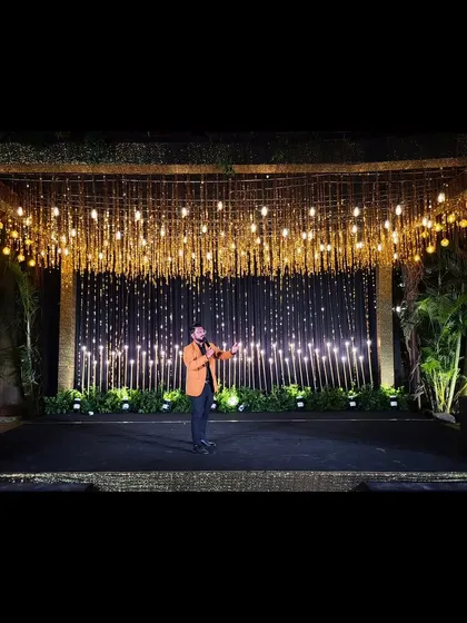 A wide shot of me owning the stage. A grand stage sets the tone for a grand celebration.