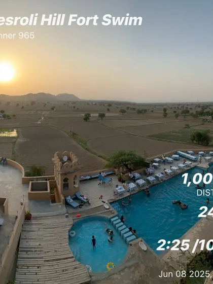 A beautiful sunrise view over the pool during a morning recovery swim at Kesroli Hill Fort. Starting the day with a light swim is a great way to stay active on vacation.