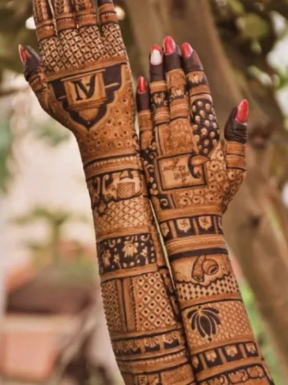 A beautiful back-hand design with the couple's initial, lotus flowers, and traditional bands. The back of the hand is just as important as the front.
