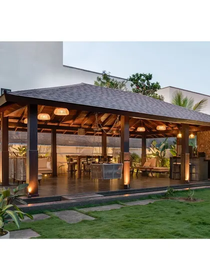We designed this outdoor pavilion as a peaceful retreat within the garden. The wooden structure and comfortable seating make it the perfect spot for relaxing or hosting parties.