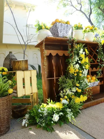 A closer look at the rustic-chic decor at a Rajasthan destination wedding, featuring a wooden bar and fresh lemon accents.