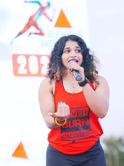 Proud, loud, and ready to cheer the crowd! This is me in my element, microphone in hand, energy at full blast.