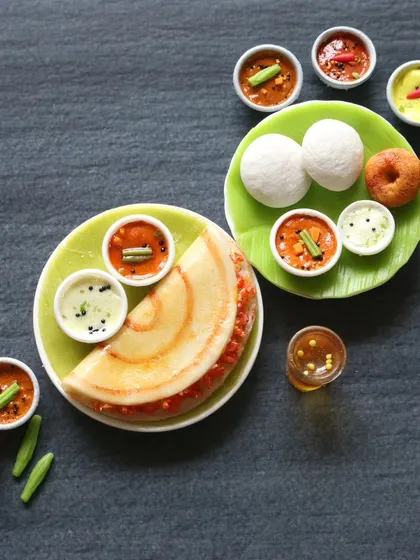 A close-up of a miniature masala dosa and idli with vada. In my classes, I focus on getting the small details right, like the texture of the sambhar and the color of the chutney.