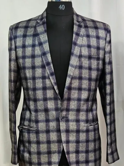 Make a statement with this stylish plaid blazer, a great rental option for a fashionable look.