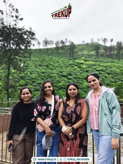 A group of women enjoying the view from a tea estate. My treks are a safe and welcoming space for everyone, especially solo women travelers.