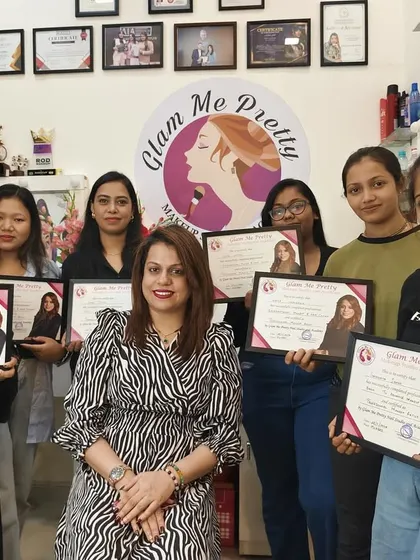 Posing with my newly certified makeup artists. Their journey at the academy has been incredible, and I am excited for their future.