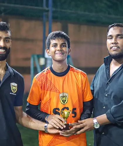 Naitik Gowda receiving his Player of the Month trophy. These moments of recognition are important for motivating our young athletes.