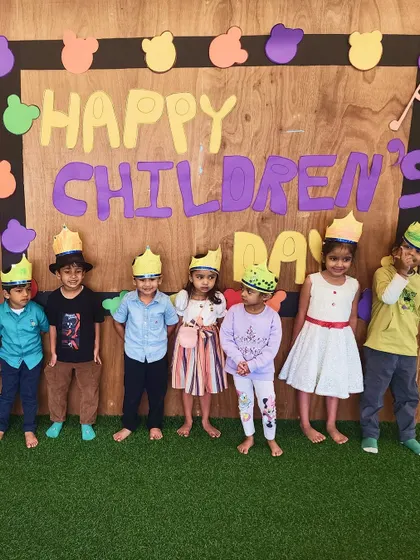 A group of children proudly wear their handmade crowns for Children's Day. Crafting their own props is a key part of our events, giving them a sense of ownership and pride.