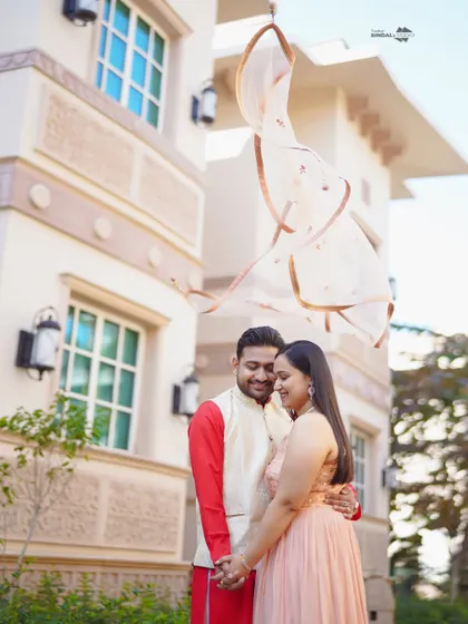 A classic Bollywood-style moment at the luxurious ITC Grand Bharat. The flowing dupatta adds a touch of cinematic drama to this romantic pre-wedding portrait.