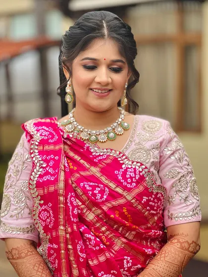A beautiful look for a Mayra ceremony, featuring a traditional bandhani dupatta and a soft, elegant makeup look.