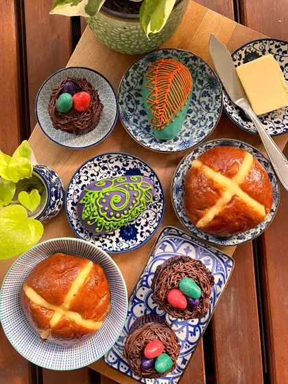 My Easter menu is a limited run of festive treats. Here you can see my brioche hot cross buns, Easter nest cupcakes, and hand-decorated almond marzipan eggs.