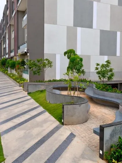 The flowing concrete forms of the seating areas at POETREE guide movement through the space. The design encourages informal gatherings and provides quiet spots for reflection.