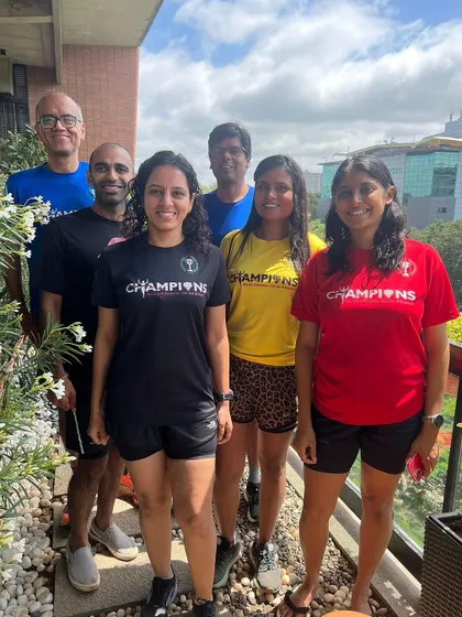 A group of Champions posing together after the Bengaluru Ultra. Supporting each other through tough challenges is what our tribe is all about.