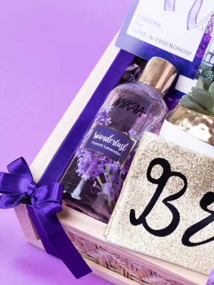 A close-up of the bride-to-be hamper, showing the glittery 'Bride' pouch and French Lavender body mist. It's all about making her feel special before the big day.