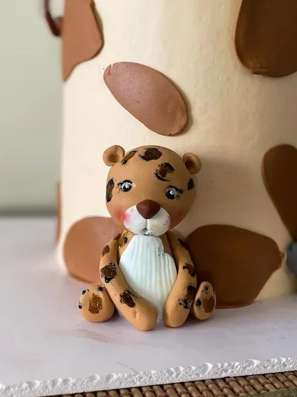 Look at this sweet little leopard, handcrafted and ready for a party.