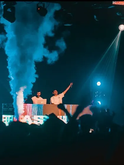 On stage at IIT Patna, with blue smoke cannons adding to the atmosphere.
