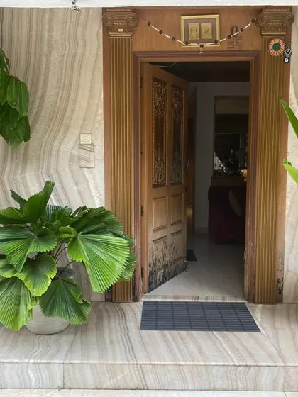 We help you make a welcoming first impression at home. This entryway is enhanced with a curated selection of potted plants, including a Fan Palm and Bird of Paradise, in stylish FRC planters that add life and character to the entrance.