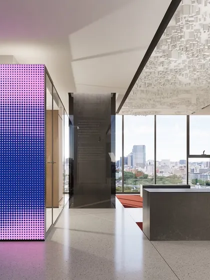 The reception at the Vian Office in Hyderabad, designed to create a futuristic and innovative first impression. A large-scale LED screen displays abstract art, while the view opens up to the city skyline, immediately setting a tone of sophistication and forward-thinking vision.