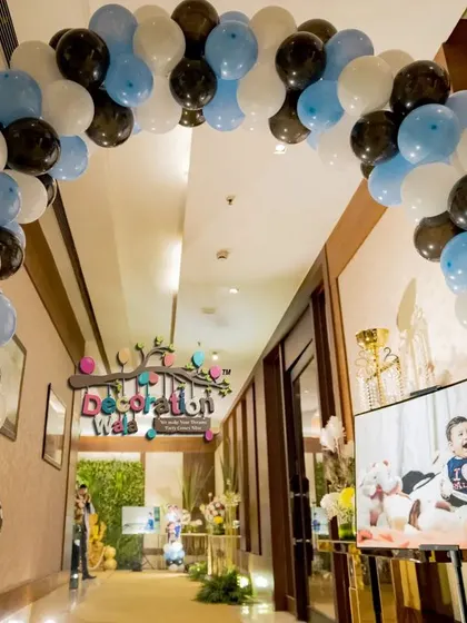 A balloon arch is a great way to make a grand entrance. For this Boss Baby party, I used a classic color scheme of blue, black, and white to guide guests into the celebration hall.