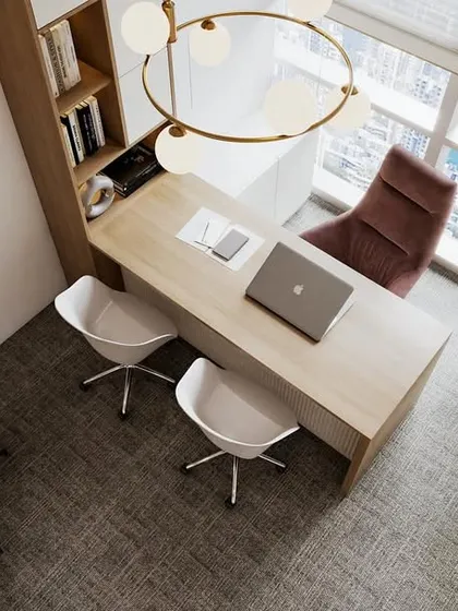 Another view of an executive office in the Japandi project, showcasing a different configuration. The space features a light wood desk, contemporary art, and a large plant, reinforcing the connection to nature that is central to biophilic design.