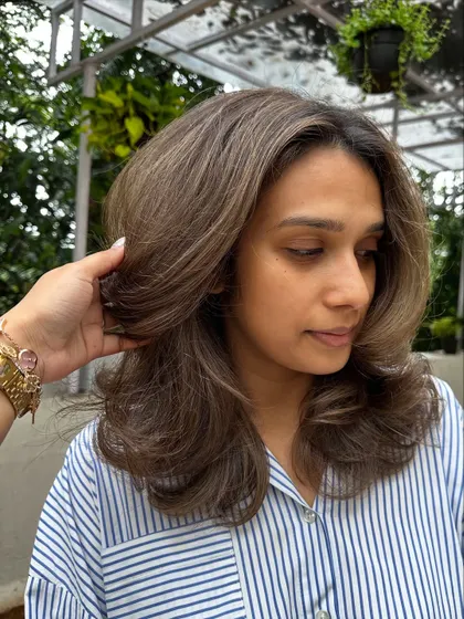 A classic blowout on a fresh layered cut. This styling technique really shows off the precision of the cut and gives the hair incredible volume.