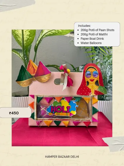 This paper packaging Holi hamper is our most affordable option at ₹450. It includes paan shots, matthi, a Paper Boat drink, and water balloons, offering great value.