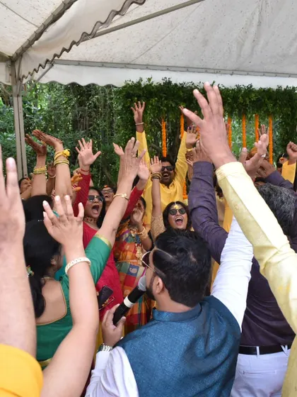 Getting the whole crowd to raise their hands and cheer during a Haldi game. Crowd engagement is my number one priority.
